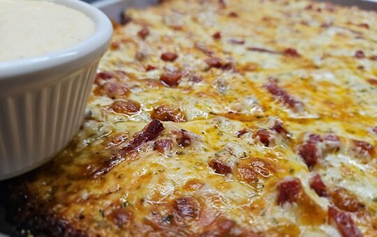 Slice of The Throwback pizza with pepperoni ranch dip at Monte Bello Pizzeria in Lemay, MO